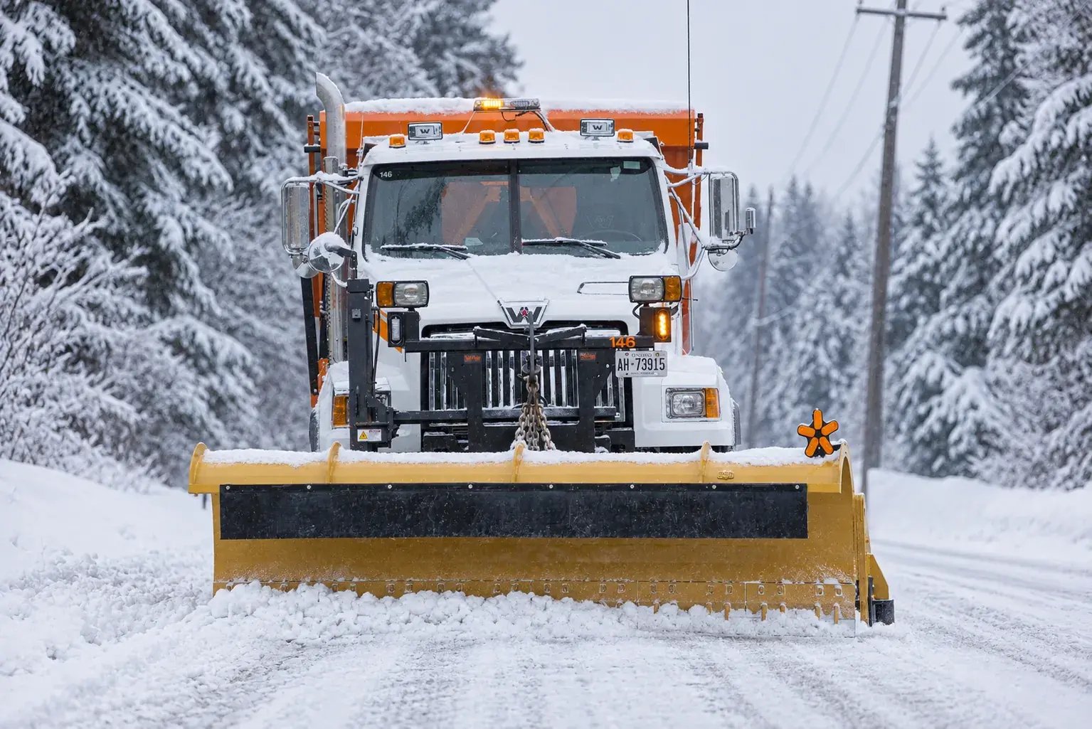 Metal Pless TruckMaxx clearing snow from a municipal road